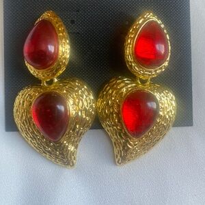 Gold tone earrings with red stone